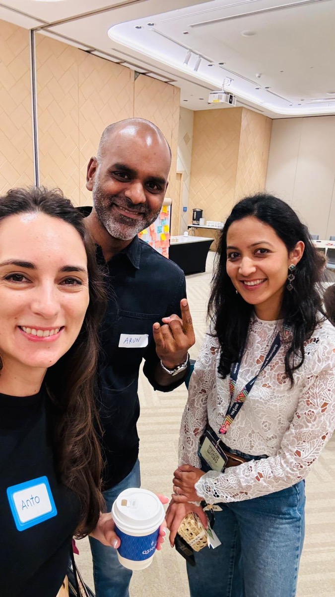 Xcapit team presenting AidLink at Devcon 2024, with Antonella Perrone showcasing the Shelter platform